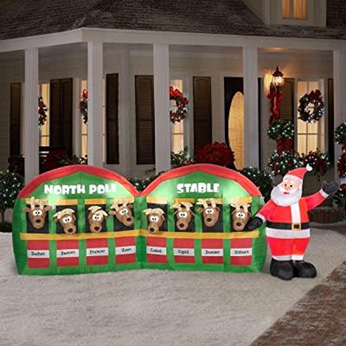 CHRISTMAS INFLATABLE SANTA W/ REINDEER IN NORTH POLE STABLE